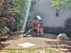 Backyard features a fun playground with a swing set and slide for outdoor enjoyment at 1263 Linden Ne Ct, Atlanta, GA 30329