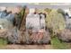 This is an aerial view of a beautiful home with mature trees in a quiet neighborhood at 2269 Howell Farms Nw Trl, Acworth, GA 30101