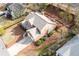 An aerial view of a well-maintained home with a large backyard, mature trees, and a two-car garage at 2269 Howell Farms Nw Trl, Acworth, GA 30101