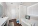 Bathroom featuring a soaking tub, stand-up shower, and wood-look flooring at 2269 Howell Farms Nw Trl, Acworth, GA 30101