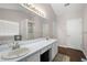 Bright bathroom with double sinks, white cabinets, shower, and soaking tub at 2269 Howell Farms Nw Trl, Acworth, GA 30101