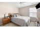 Comfortable bedroom featuring soft carpet, large window, and decorative pillows at 2269 Howell Farms Nw Trl, Acworth, GA 30101