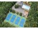 Aerial view of community amenities: tennis courts, a pool, a playground, and parking at 2269 Howell Farms Nw Trl, Acworth, GA 30101