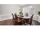 Elegant dining room with a large wooden table, chandelier, and wainscoting at 2269 Howell Farms Nw Trl, Acworth, GA 30101