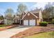 Charming two-story brick and siding home with manicured landscaping and a two-car garage at 2269 Howell Farms Nw Trl, Acworth, GA 30101