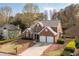 Charming two-story brick home featuring a two-car garage and well-maintained landscaping at 2269 Howell Farms Nw Trl, Acworth, GA 30101