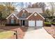 Charming two-story brick home featuring a two-car garage and well-maintained landscaping at 2269 Howell Farms Nw Trl, Acworth, GA 30101