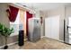 A kitchen corner with stainless steel refrigerator, laminate flooring, and a water cooler at 2269 Howell Farms Nw Trl, Acworth, GA 30101