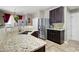 A kitchen featuring stainless steel appliances, granite countertops, and dark wood cabinets at 2269 Howell Farms Nw Trl, Acworth, GA 30101