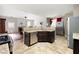 An open kitchen with stainless steel appliances, granite countertops, and tile flooring at 2269 Howell Farms Nw Trl, Acworth, GA 30101