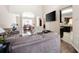 Open-concept living room with wood floors and a view of the dining area at 2269 Howell Farms Nw Trl, Acworth, GA 30101