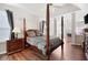Bright and spacious bedroom featuring a four poster bed and hardwood floors at 2269 Howell Farms Nw Trl, Acworth, GA 30101