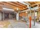 An unfinished basement space showing exposed beams and support columns at 2585 Whisper Trail, Douglasville, GA 30135