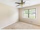 This bedroom features natural light through a window and neutral colored walls with plush carpet at 2585 Whisper Trail, Douglasville, GA 30135