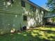 Exterior shot of the house showing the backyard, siding, basement, and a small deck at 2585 Whisper Trail, Douglasville, GA 30135