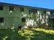 Exterior shot of the house showing the backyard, siding, basement, and a small deck at 2585 Whisper Trail, Douglasville, GA 30135