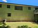 Exterior shot of the house showing the backyard, siding, basement, and a small deck at 2585 Whisper Trail, Douglasville, GA 30135
