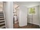 Basement featuring a laundry room with a washer and dryer, a window, and hardwood floors at 2623 Riggs Dr, Atlanta, GA 30344