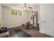 Basement featuring workout equipment, a window, and hardwood floors at 2623 Riggs Dr, Atlanta, GA 30344
