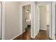 Hallway featuring hardwood floors and doorways leading to bedrooms at 2623 Riggs Dr, Atlanta, GA 30344