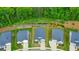 Aerial view of homes in a peaceful neighborhood, showcasing well-maintained lawns and mature trees at 316 Denali Butte Ter, Canton, GA 30114