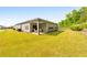 Spacious backyard with a covered patio area and lush green lawn, perfect for outdoor entertaining at 316 Denali Butte Ter, Canton, GA 30114