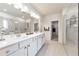 Elegant bathroom featuring dual vanity sinks, walk-in shower, and tile flooring at 316 Denali Butte Ter, Canton, GA 30114