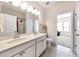 Bright bathroom boasting a double sink vanity, a large mirror, and a separate shower area at 316 Denali Butte Ter, Canton, GA 30114