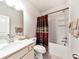 Bright bathroom featuring a combination tub and shower, a vanity with a sink, and neutral decor at 316 Denali Butte Ter, Canton, GA 30114