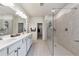 Bathroom featuring a double sink and walk-in shower at 316 Denali Butte Ter, Canton, GA 30114
