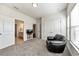 Another bedroom featuring a chair, natural light and access to another room at 316 Denali Butte Ter, Canton, GA 30114