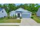 Well-maintained home with a two-car garage, lush lawn and manicured landscaping at 316 Denali Butte Ter, Canton, GA 30114