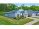 Beautiful gray home featuring manicured landscaping, a two-car garage and sidewalk leading to the front door at 316 Denali Butte Ter, Canton, GA 30114