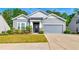 Charming single-Gathering home with manicured lawn, gray siding, and attached two-car garage at 316 Denali Butte Ter, Canton, GA 30114