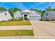 Charming single-Gathering home with a well-manicured lawn, gray siding, and an attached two-car garage at 316 Denali Butte Ter, Canton, GA 30114
