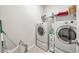 Well-organized laundry room with modern washer, dryer, shelving, and ample storage space at 316 Denali Butte Ter, Canton, GA 30114