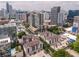 Stunning aerial view of the community with city skyline views, pool, and lush landscaping at 1075 Peachtree Ne Walk # A204, Atlanta, GA 30309