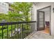 Balcony looking onto trees, with a view to a table setting at 1075 Peachtree Ne Walk # A204, Atlanta, GA 30309