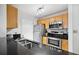 Kitchen featuring stainless appliances, granite countertops and wood cabinets at 1075 Peachtree Ne Walk # A204, Atlanta, GA 30309