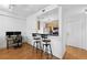 Living space featuring a workspace and kitchen area with hardwood floors at 1075 Peachtree Ne Walk # A204, Atlanta, GA 30309