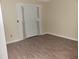 Bedroom with wood floors and a door leading outside at 1119 Oakwood Manor Ct, Decatur, GA 30032