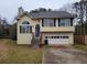 Charming two-story home featuring a two car garage and traditional architectural details at 1119 Oakwood Manor Ct, Decatur, GA 30032