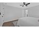 Bright bedroom featuring a ceiling fan, fresh paint, and hardwood floors, perfect for comfortable living at 1766 Blossom Ln, Austell, GA 30168