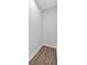 Walk in closet features clean neutral paint and hardwood flooring at 1766 Blossom Ln, Austell, GA 30168