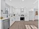 Modern kitchen with white cabinets, stainless steel appliances, quartz countertops, and a stylish design at 1766 Blossom Ln, Austell, GA 30168