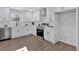 Well-equipped kitchen boasting white cabinets, stainless steel appliances, and ample counter space, ideal for cooking and entertaining at 1766 Blossom Ln, Austell, GA 30168