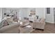 Open-concept living room with stylish furniture, contemporary decor, and views into the kitchen area at 1766 Blossom Ln, Austell, GA 30168