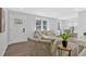 Bright living room showcasing modern decor, comfortable seating, and an open layout to the kitchen at 1766 Blossom Ln, Austell, GA 30168