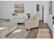 Inviting living room with stylish furniture, a decorative rug, and an open doorway to another room at 1766 Blossom Ln, Austell, GA 30168