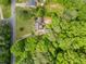 An aerial view showing the property's secluded location, featuring mature trees and surrounding greenery at 1822 Morgan Rd, Canton, GA 30115
